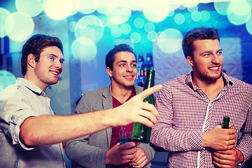 Image showing group of male friends with beer in nightclub