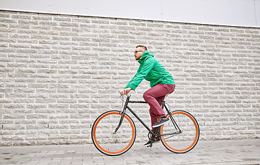 Image showing young hipster man riding fixed gear bike