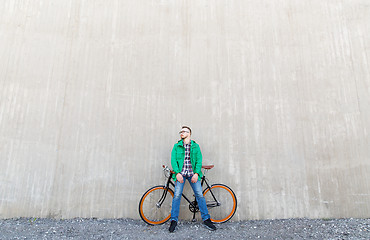 Image showing happy young hipster man with fixed gear bike