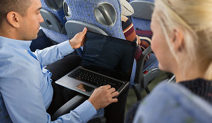 Image showing close up of passengers with laptop in travel bus