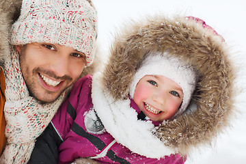 Image showing happy family in winter clothes outdoors