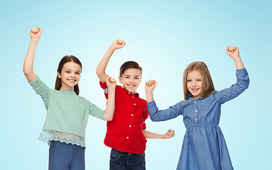 Image showing happy boy and girls celebrating victory