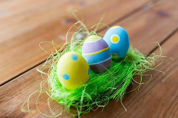 Image showing close up of colored easter eggs and grass