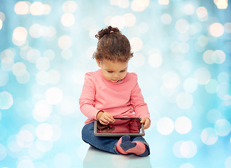 Image showing little baby girl playing with tablet pc computer