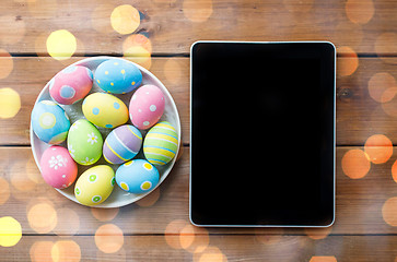 Image showing close up of easter eggs and blank tablet pc