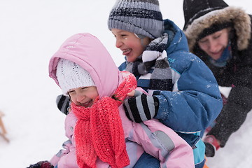 Image showing group of kids having fun and play together in fresh snow