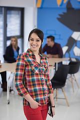 Image showing portrait of young business woman at office with team in backgrou