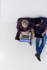 Image showing top view of  couple working on laptop computer at startup office