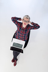 Image showing top view of young business woman working on laptop computer