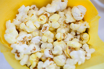 Image showing Tasty popcorn in yellow paper bag