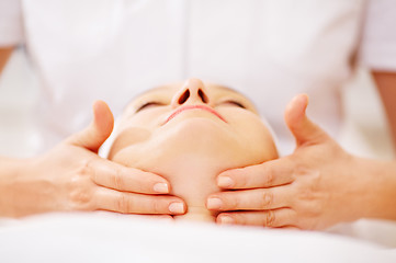 Image showing Woman under facial treatment at beauty spa