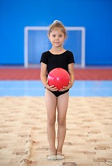 Image showing Little gymnast girl with red ball