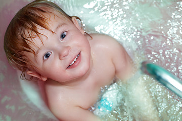 Image showing Little boy takes a bath.