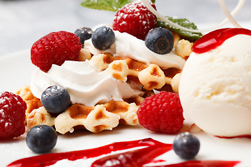 Image showing Waffle with cream, ice cream and fresh berries