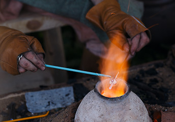 Image showing Glass artist in his workshop