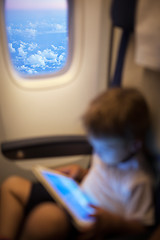 Image showing Child with pad in flying plane