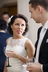 Image showing Bride and groom enjoy a drink at the wedding