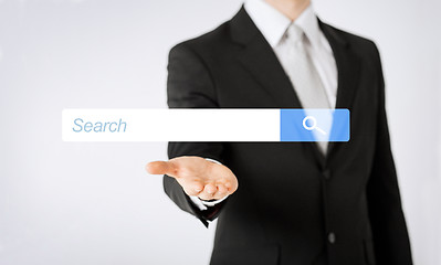 Image showing close up of man showing internet search bar