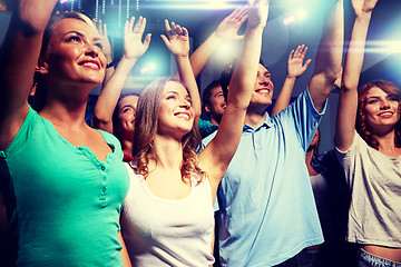 Image showing smiling friends at concert in club