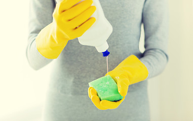 Image showing close up of woman with sponge and cleanser