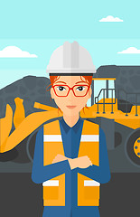 Image showing Miner with mining equipment on background.