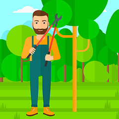 Image showing Farmer with pruner in garden.