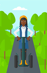 Image showing Woman riding on electric scooter.