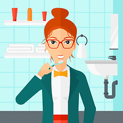 Image showing Woman brushing teeth.