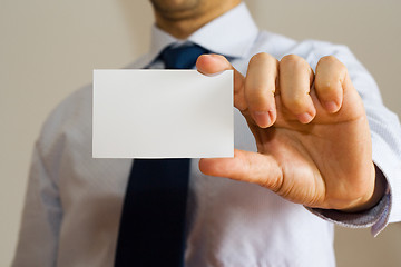 Image showing Business man holding a name card