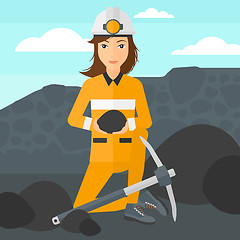 Image showing Miner holding coal in hands.