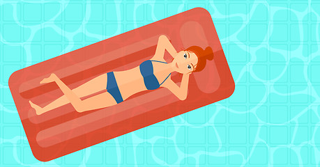 Image showing Woman relaxing in swimming pool.