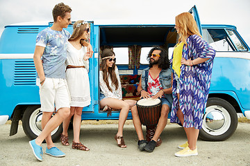 Image showing hippie friends with tom-tom playing music over car