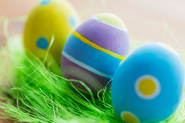 Image showing close up of colored easter eggs and grass