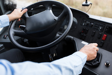 Image showing close up of driver driving passenger bus