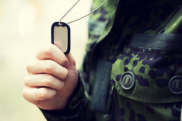 Image showing close up of young soldier in military uniform