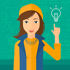 Image showing Woman pointing at light bulb.