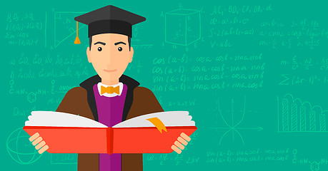 Image showing Man in graduation cap holding book.