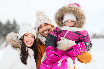 Image showing happy family with child in winter clothes outdoors