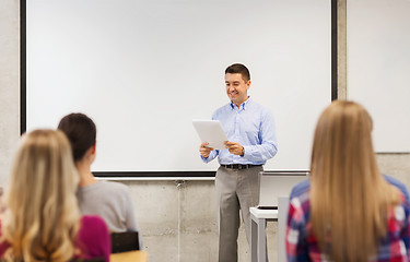 Image showing group of students and teacher with notepad