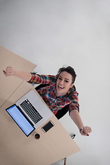 Image showing top view of young business woman working on laptop