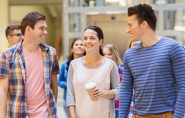 Image showing group of smiling students with paper coffee cups