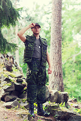 Image showing young soldier or ranger in forest