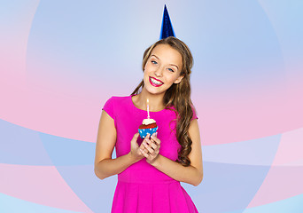 Image showing happy woman or teen girl with birthday cupcake