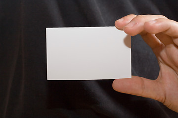 Image showing White card on black