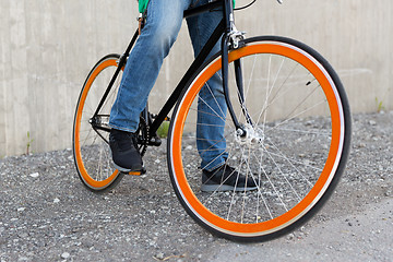 Image showing close up of man on fixed gear bike on city street