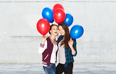 Image showing happy teenage girls with helium balloons