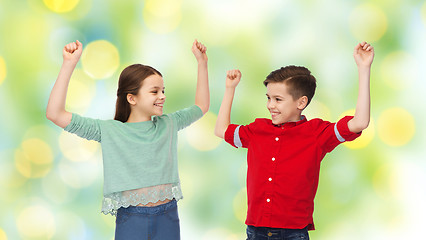 Image showing happy boy and girl celebrating victory