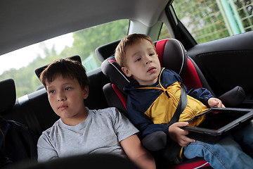 Image showing Children sitting in the car and looking at road