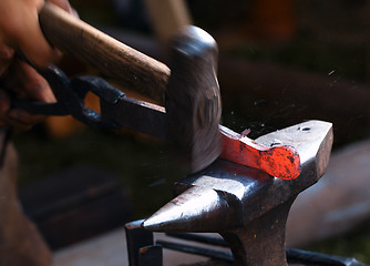 Image showing Blacksmith at work.