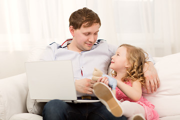 Image showing Daughter wants to play with busy dad